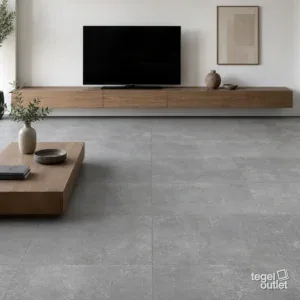Sfeerbeeld (illustratie): moderne woonkamer met witte muren en een vloer in donkergrijze tegels